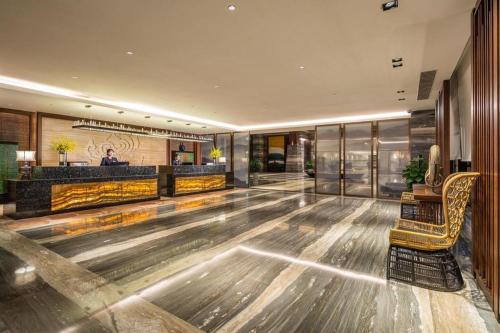 an empty lobby with a bowling alley in a hotel at Dali Hotel in Dali