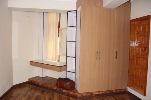 a room with a cabinet and a window at Hunza Story in Karimabad Hunza