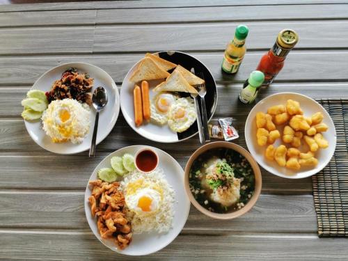 a group of plates of food on a table at Hihotel Saraburi in Sara Buri