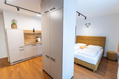 Ένα ή περισσότερα κρεβάτια σε δωμάτιο στο Wildfang Apartments