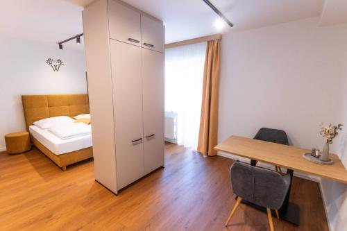 Ένα ή περισσότερα κρεβάτια σε δωμάτιο στο Wildfang Apartments