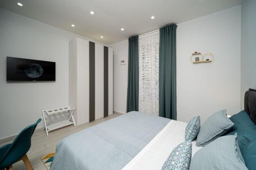 Ένα ή περισσότερα κρεβάτια σε δωμάτιο στο Margiò Bed and Breakfast