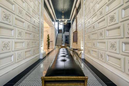 a hallway with a long bench in a building at Curtiss Hotel, an Ascend Collection Hotel in Buffalo