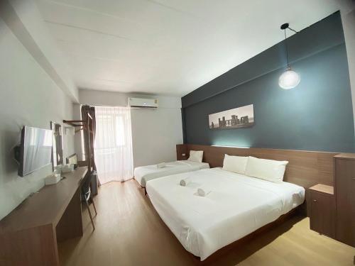 Postel nebo postele na pokoji v ubytování Shane Hotel