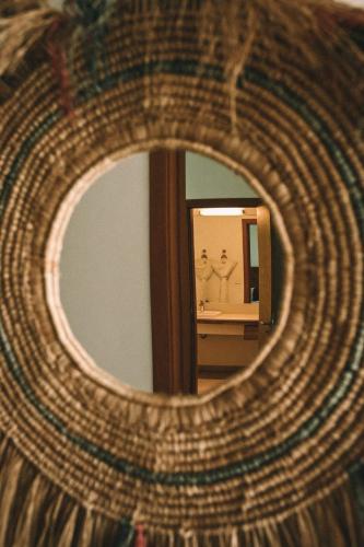 a mirror reflection of two men in a bathroom at Mythic Suites & Villas by MJ Holidays in Grand Gaube