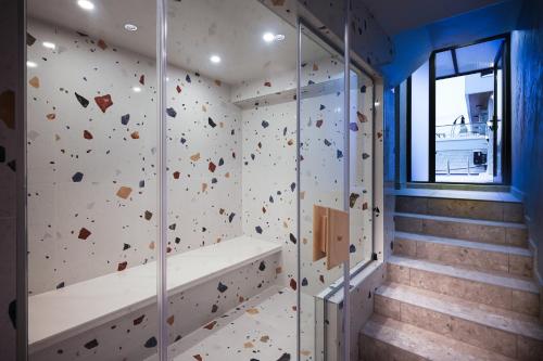 an indoor rock climbing wall in a room with stairs at Saint George apartments in Varna City