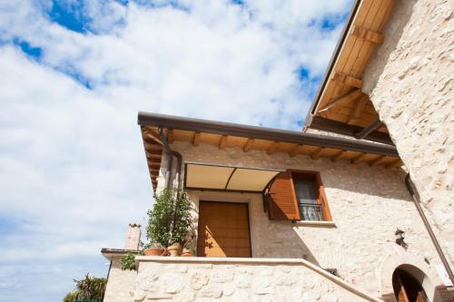 a facade of a house with potted plants at La Zaffera in Alatri