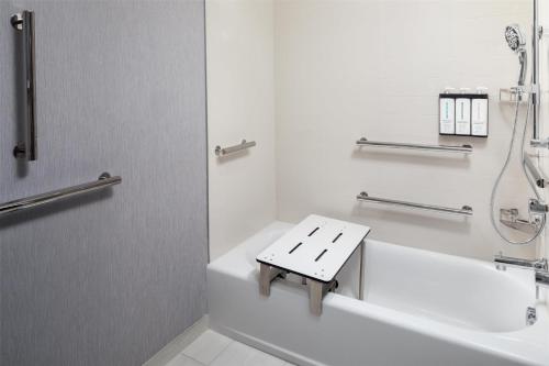 a bathroom with a sink and a bath tub at Hyatt Place Cape Canaveral in Cape Canaveral
