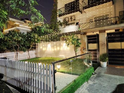 a house with a glass staircase in front of a building at The G8 in Noida