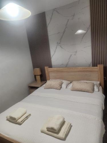 Postel nebo postele na pokoji v ubytování Apartmani “Dunja”