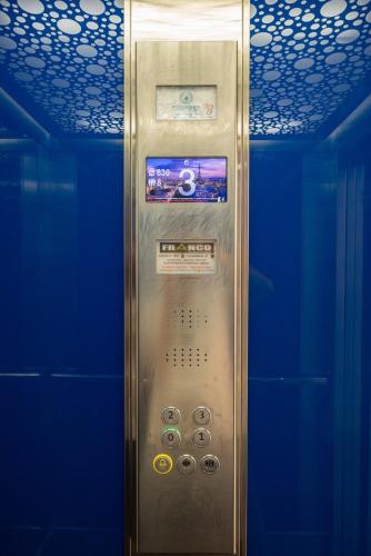 a elevator in a room with a blue wall at AURA Apt Modern 1BR in Central Limassol and Free Parking in Limassol