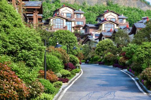 a winding road in a village with houses at Avatar Valley Villas in Zhangjiajie