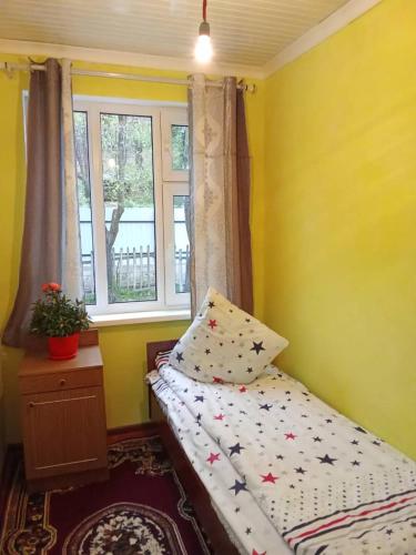 a small bedroom with a bed and a window at Sabira guest house English spoken in Arkit