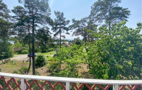 a view from a balcony of a yard with trees at 2 Bedroom Stunning Home In Kalmar in Kalmar
