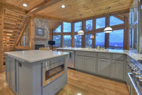 a large kitchen with a large island in a house at Honey Hill Gorgeous long-range mountain views in Morganton