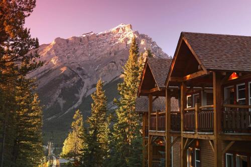 a lodge with a mountain in the background at Buffalo Mountain Lodge in Banff