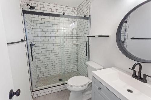 a bathroom with a shower and a toilet and a sink at C323C - Keep On Duckin' in Duck