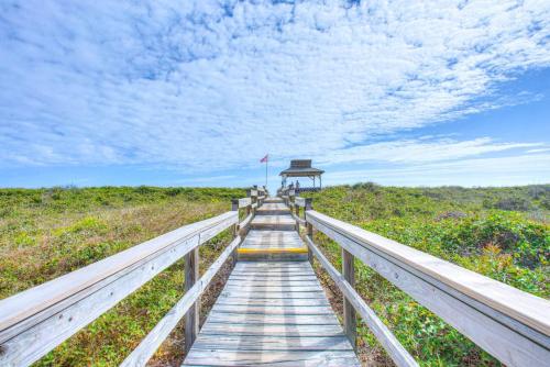 a boardwalk to the beach with people walking on it at C323C - Keep On Duckin' in Duck