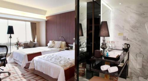 a hotel room with a bed and a bathroom at Changsha Huatian Hotel in Changsha