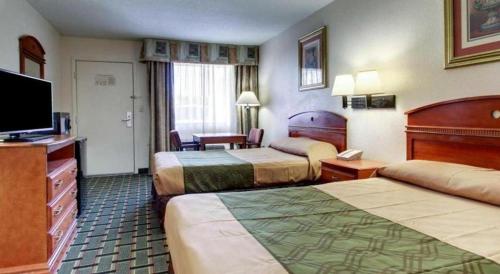 Ένα ή περισσότερα κρεβάτια σε δωμάτιο στο Econo Lodge Meridian South
