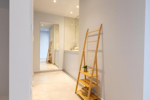 a ladder in a room with a kitchen at Laconian Blue Residence in Gythio
