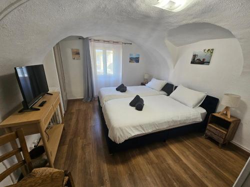 Ένα ή περισσότερα κρεβάτια σε δωμάτιο στο Auberge Saint Martin