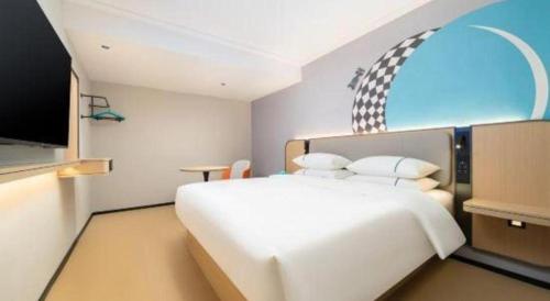 Postel nebo postele na pokoji v ubytování City Comfort Inn Beihai Hepu Bus Terminal