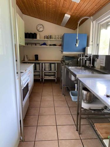 a kitchen with a sink and a counter top at Rosenby Hytten in Dronninglund