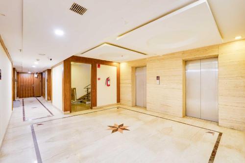 an empty room with a star on the floor at Palette Alandur Near Chennai Airport in Chennai
