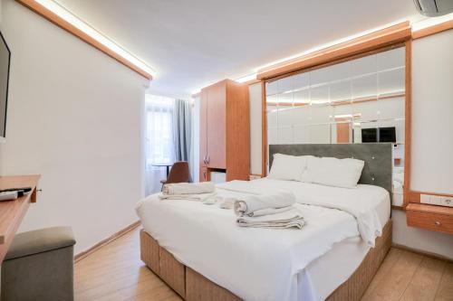 Ένα ή περισσότερα κρεβάτια σε δωμάτιο στο Viva Butik Sirkeci