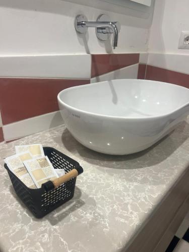 a bathroom counter with a sink and a bowl on it at Le tre sirene depandance in Atrani