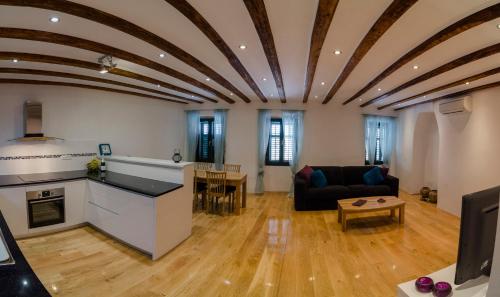 a living room with a couch and a table at Apartment Sea View in Rovinj