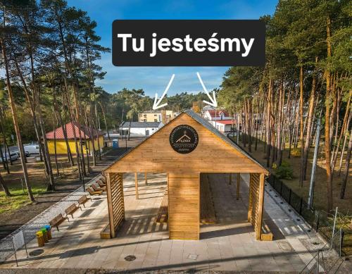 a small wooden building with the words ttu jestery on top at "Hel" Wieniec Zdrój in Włocławek