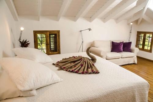 เตียงในห้องที่ Villa Ixora - Ocean Front