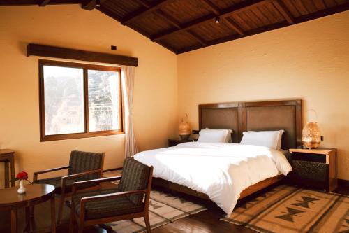 Postel nebo postele na pokoji v ubytování Mountain Lodges of Nepal - Dhampus