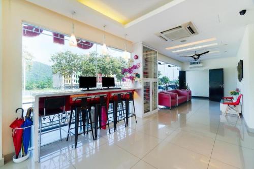 TV a/nebo společenská místnost v ubytování GM Holiday Hotel Permai Jaya