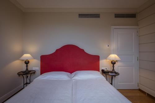 Ein Bett oder Betten in einem Zimmer der Unterkunft Resort Collina d'Oro - Hotel, Residence & Spa