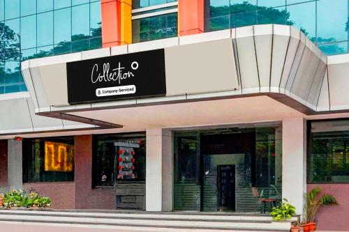 a restaurant with a sign on the side of a building at Collection O Mysore Central in Mysore