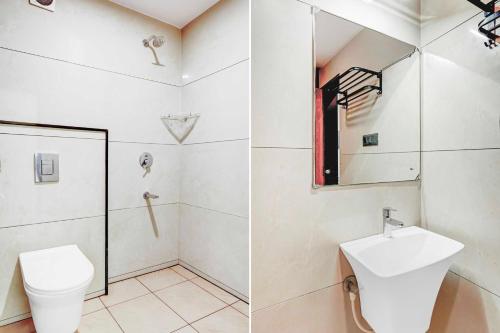 a bathroom with a toilet and a sink at Collection O Mysore Central in Mysore