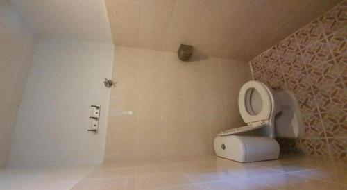 a bathroom with a toilet with the lid up at OYO 1167 Rest and Go Hotel Klang in Klang