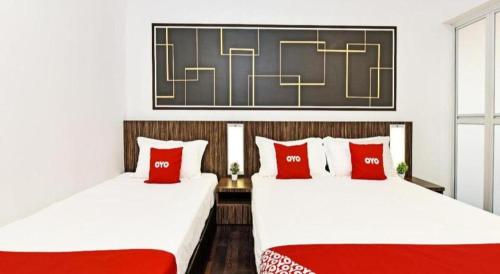 Кровать или кровати в номере Capital O 90674 4S Hotel
