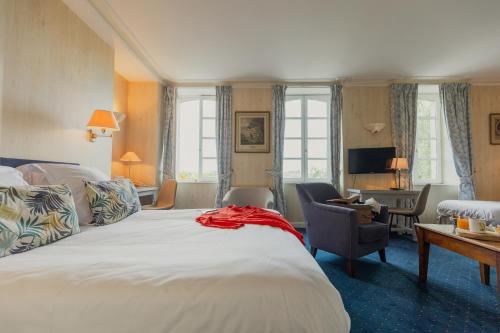 Postel nebo postele na pokoji v ubytování Hôtel Le D'Avaugour