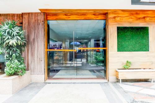 an entrance to a building with glass doors at Townhouse Oak City Centre Dhanbad in Dhanbād