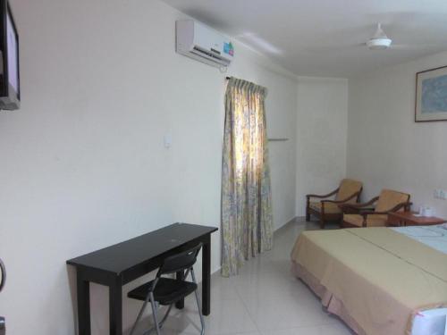 Кровать или кровати в номере Skudai Baru Hotel