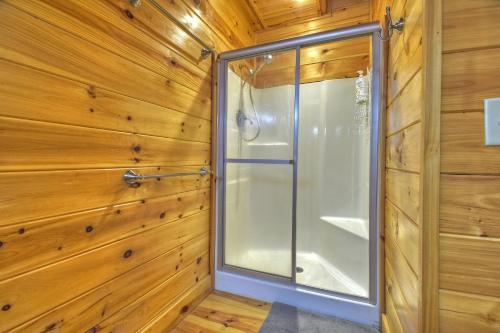 a walk in shower in a wooden wall at Buffalo Ridge Fish in the pond soak in the hot tub in Mineral Bluff