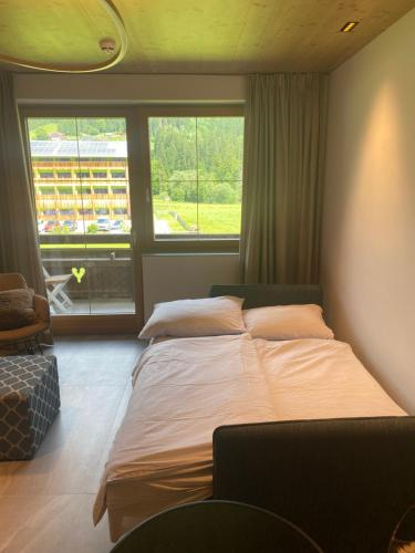 Postel nebo postele na pokoji v ubytování Kleines Chalet Hinterstoder
