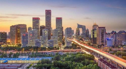 a city skyline at night with a busy freeway at Radegast Hotel CBD in Beijing