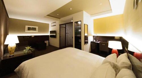Hotel Riverge Akebonoにあるベッド
