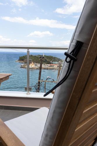 a view of the ocean from the balcony of a house at Laconian Blue Residence in Gythio