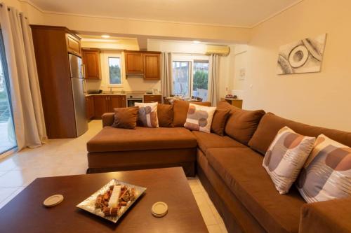 a living room with a couch and a table at Izzy's apartment in Nafpaktos